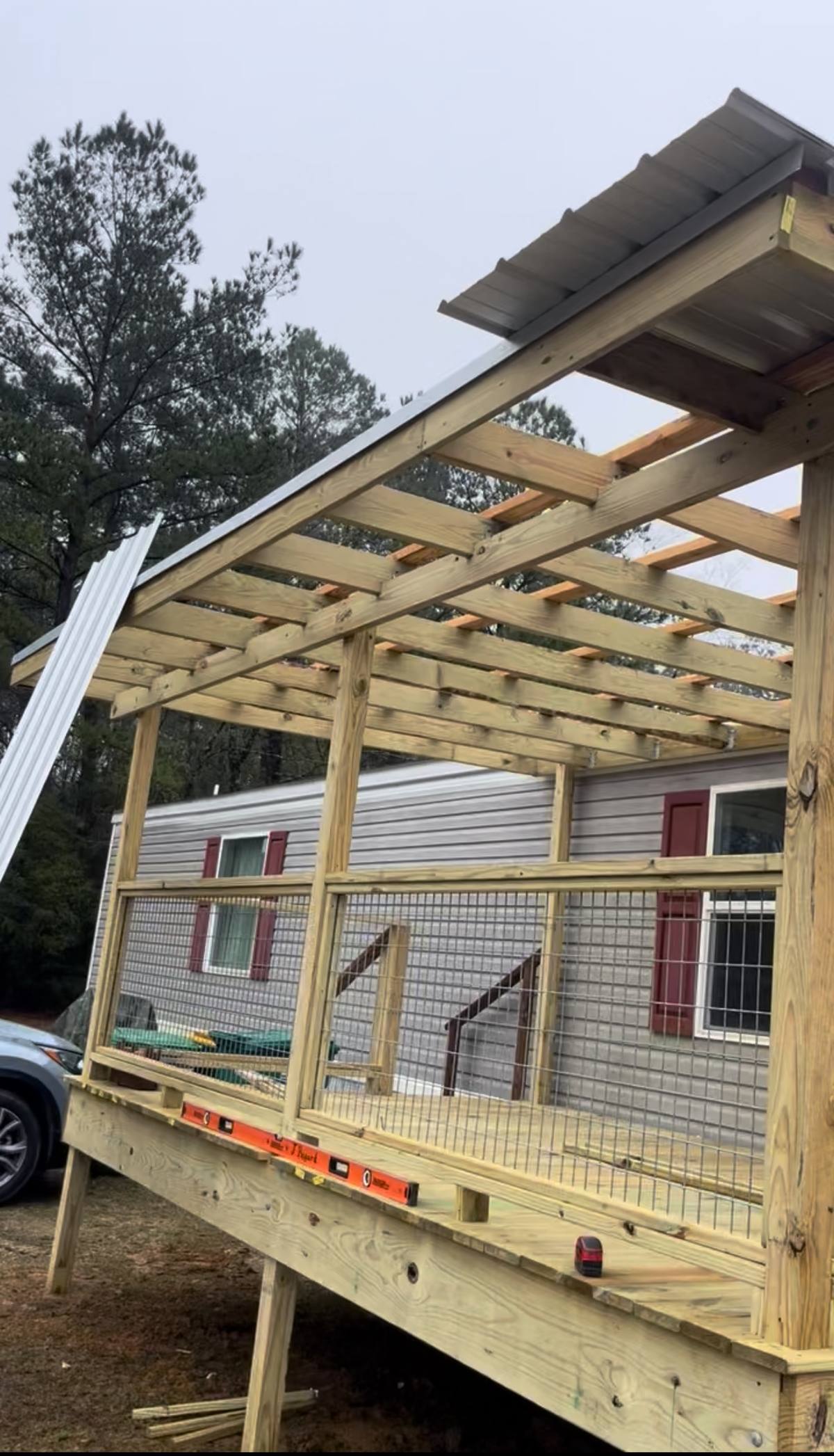 Covered porch addition being framed onto a home